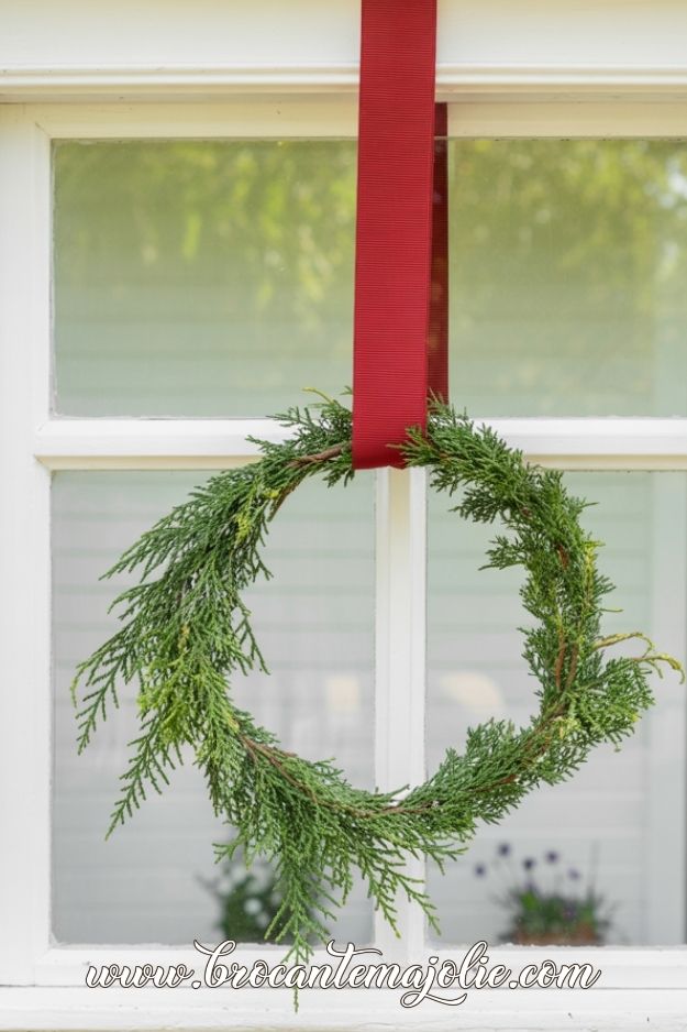 minimalist wreath on window for christmas