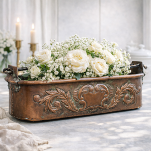 Antique French copper fish poacher with embossed scroll motifs and twisted iron handle