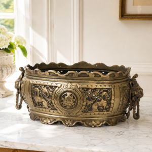 Antique French gilt bronze planter with lion head handles and ornate openwork details
