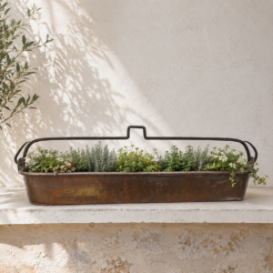Large antique French copper fish poacher with rustic patina and long rectangular shape displayed as vintage kitchen décor