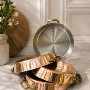 Set of 4 vintage French copper gratin pans with brass handles and tin-lined interior for individual cooking servings