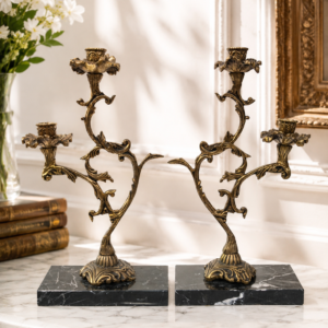 Pair of vintage French brass and marble candle holders with floral design and black marble bases