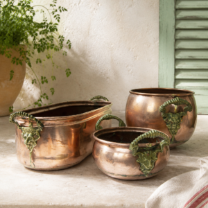 Set of vintage French copper planters with decorative ram head brass handles and aged copper patina for French country decor