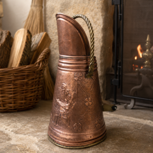 Vintage French embossed copper coal bucket with brass handle and floral repoussé motifs