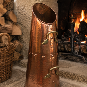 Vintage hammered copper coal bucket with brass handles and rich aged patina